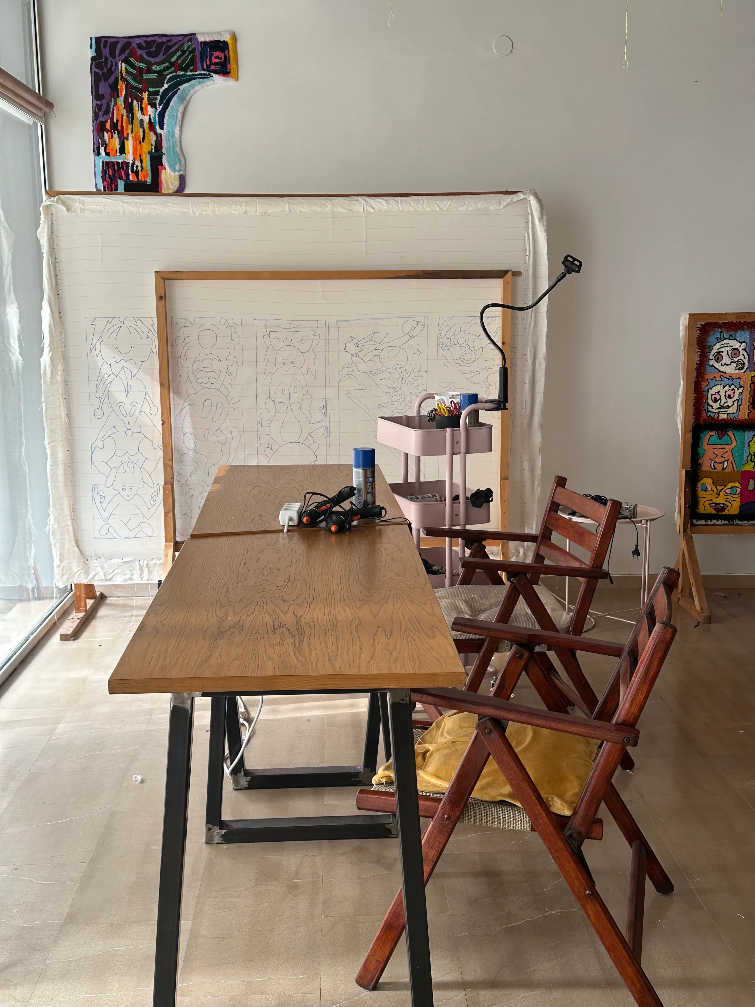 A display of various colorful tufted rugs showcasing different patterns and techniques